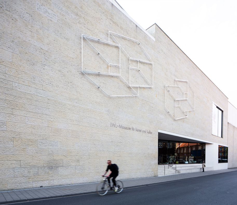 cyclist in front of the museum