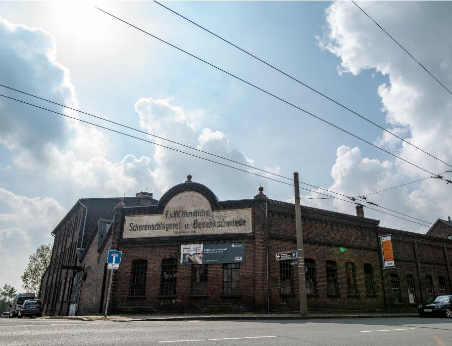 A large sign on the outside indicates the former function of today's LVR Industrial Museum