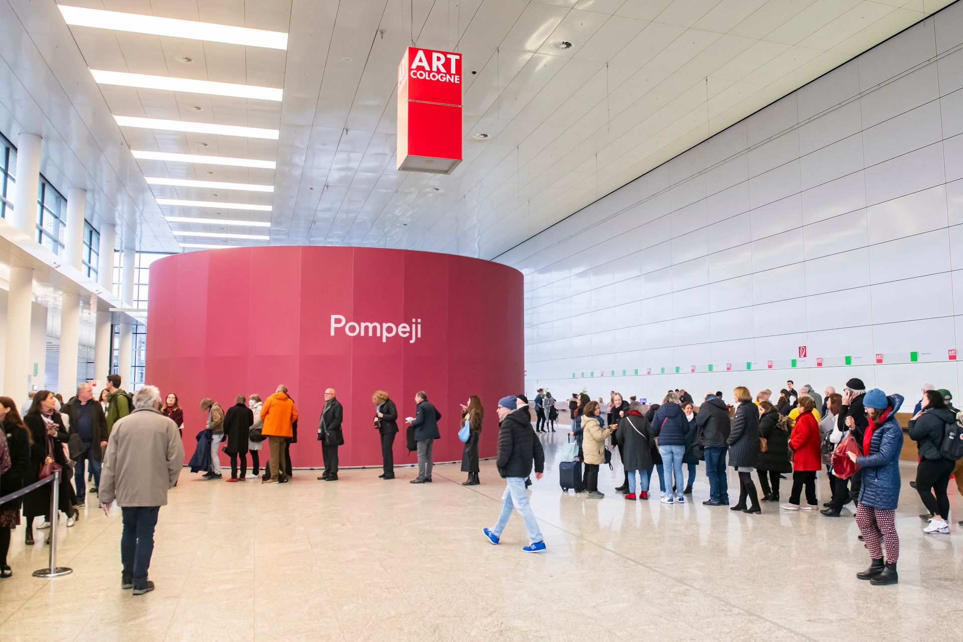 Guests gather at the South Entrance of the Cologne trade fair to gain access to ART COLOGNE