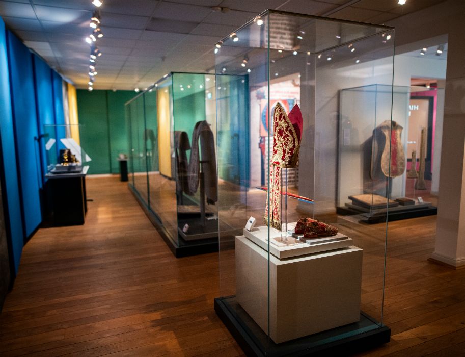 Artfully decorated chasubles, mitres and altar curtains in the treasury of Kamp Abbey