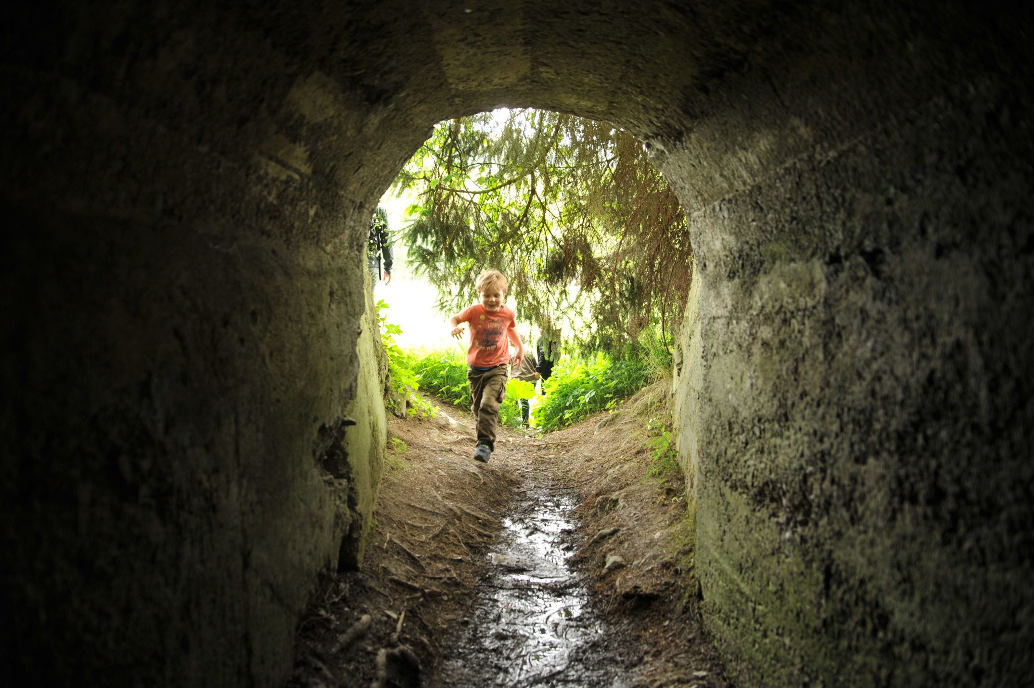 Child in tunnel on Wittgenstein slate path