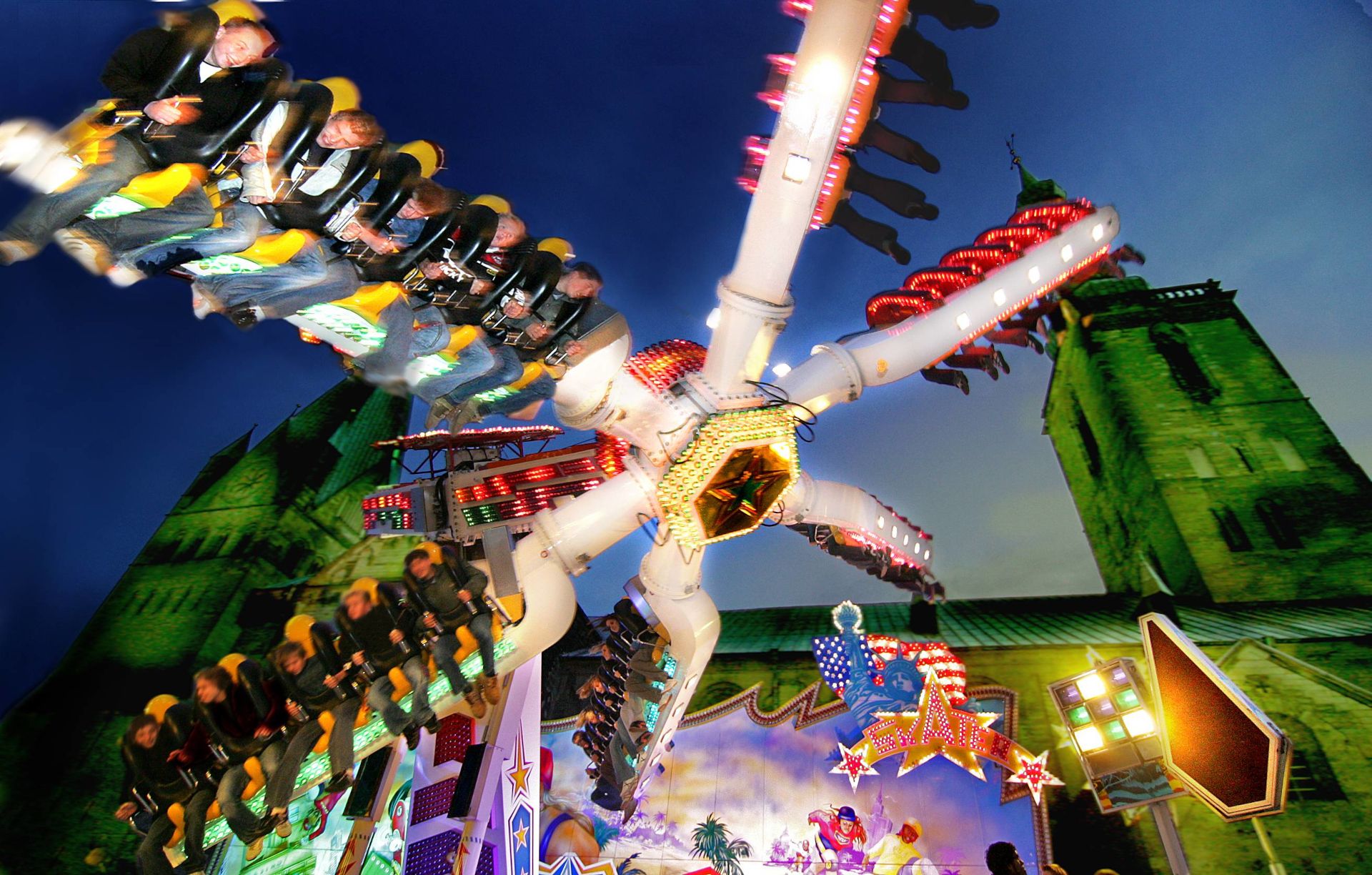 The All Saints' Fair presents modern rides against the backdrop of the old town