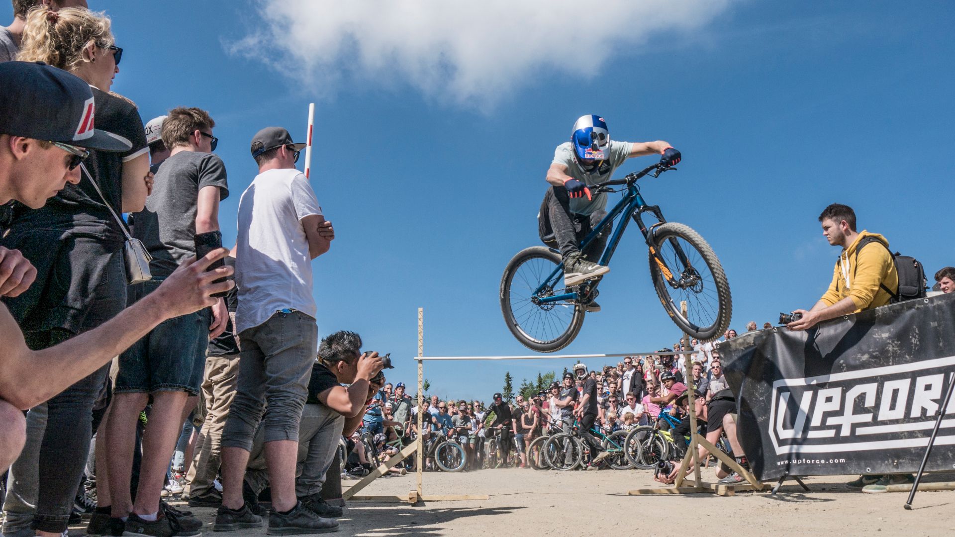 In one of the competitions, the possible jumping height is determined using a measuring bar over which the athletes have to jump with their bikes