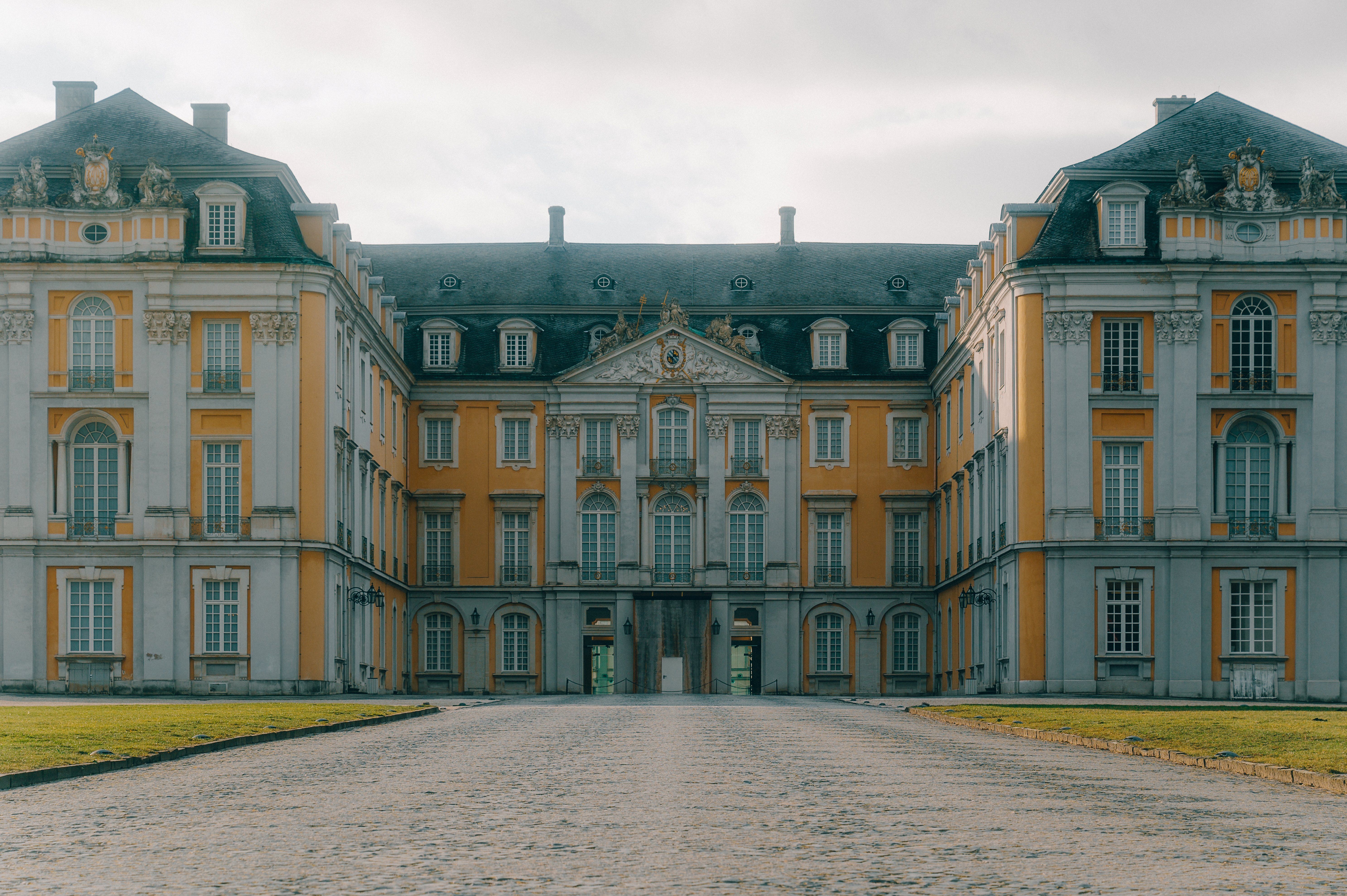 Symmetrical castle façade in yellow and white 