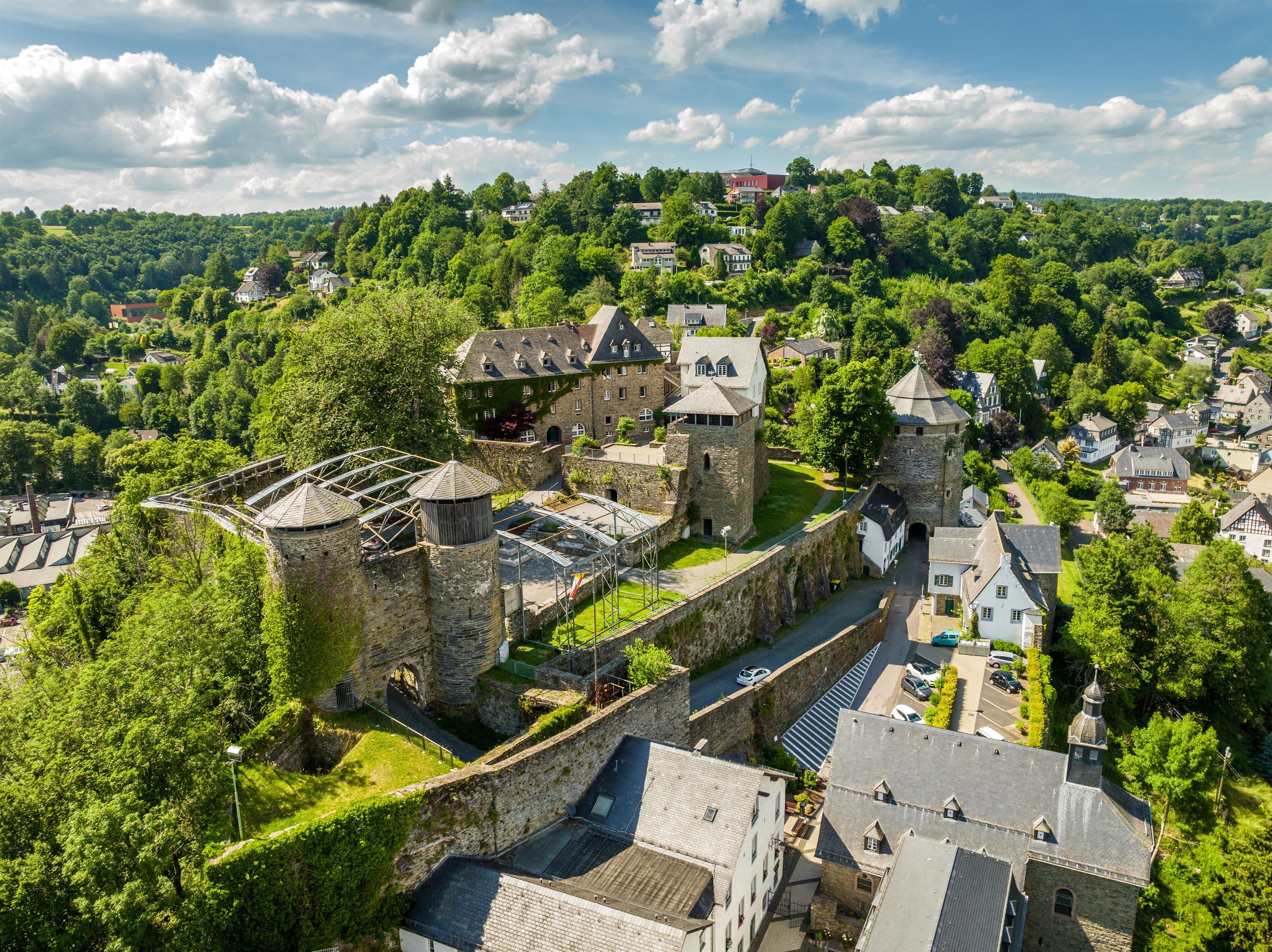 Monschau Castle is enthroned on a foothill spur